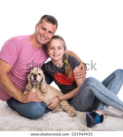 Young father with smiling daughter and pet dog on a white background
