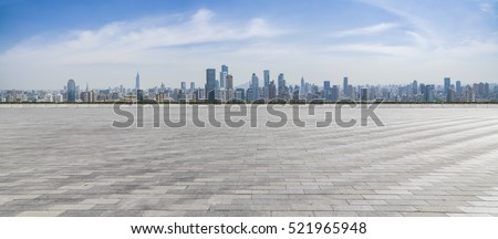 Panoramic skyline and buildings with empty concrete square floor Royalty-Free Stock Photo #521965948