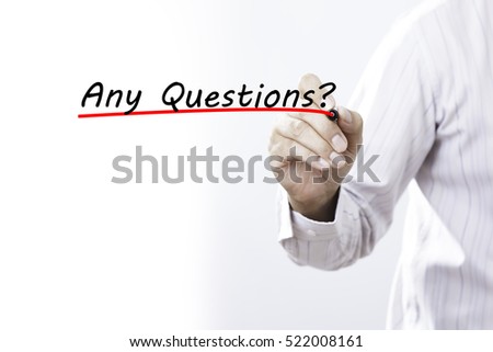 Businessman hand writing inscription "Any Questions?" with marker, concept
