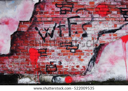 Old Brick Wall with crumbling Plaster