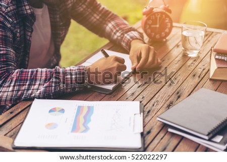 Businessman working on a desk. Freelance work at home office.
