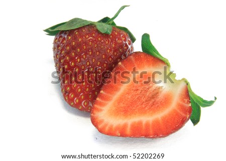Isolated fruits - cut Strawberries on white background