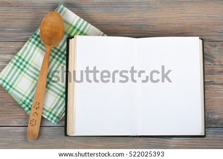 Open blank cook book, hardback books on wooden table. Copy space for ad text. Education business concept. Old blank recipe book on wooden background.