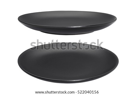Black empty plate isolated on white background Royalty-Free Stock Photo #522040156
