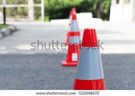 selective focus traffic cone on concrete road