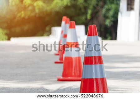 selective focus traffic cone on concrete road