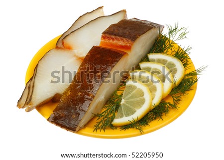 Halibut fish with lemon and dill on a yellow plate. Isolated on white background