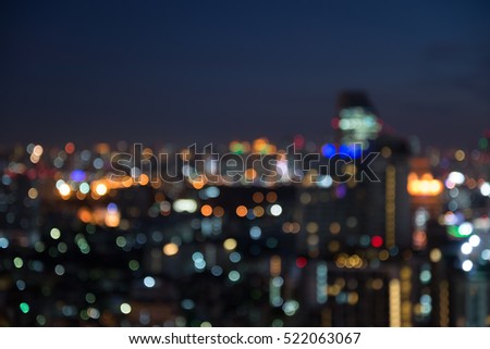 Abstract urban night light bokeh defocused background with sky space area