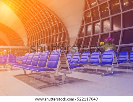 The Blue Chair In Airport background.Image is made with orange light color filters.