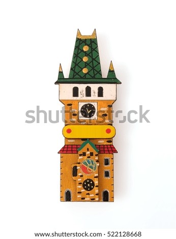 Magnetic souvenir with the image of multi-colored medieval wooden houses