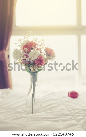 Beautiful flower and towels decoration on bedroom - Filter effect