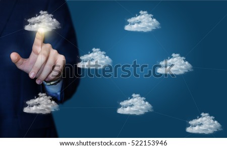 Businessman clicks on a data cloud network.