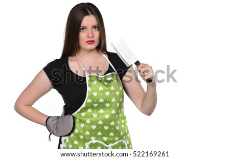 Young woman wearing kitchen apron holding knife, isolated on white