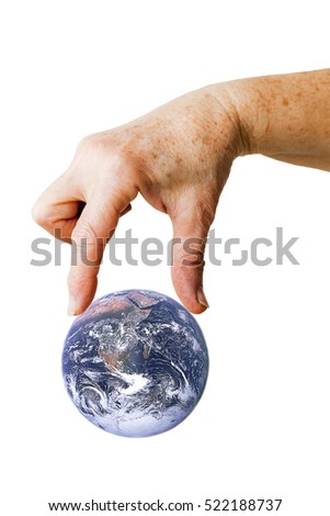 Hand picking planet Earth - Elements of this image furnished by NASA