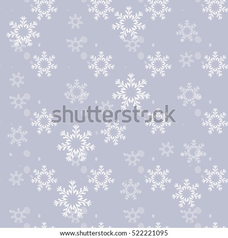 Seamless ornament in winter style. On a grey background depicts a variety of snowflakes. Royalty-Free Stock Photo #522221095