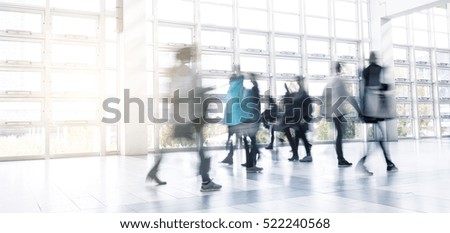 Abstract Image of People Walking at a traid fair hall