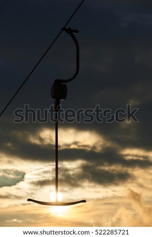 ski lift anchor at sunset

