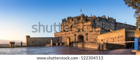 The Edinburgh Castle on a cold autumn morning at sunrise Royalty-Free Stock Photo #522304513