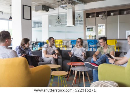 young people group in modern office have team meeting and brainstorming while working on laptop and drinking coffee Royalty-Free Stock Photo #522315271