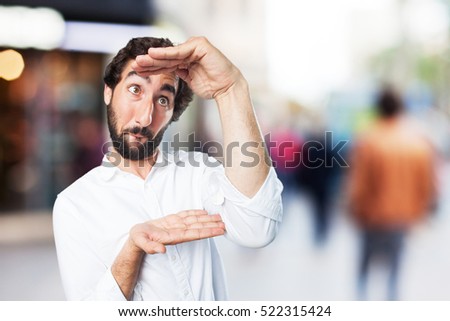 young funny man showing sign. surprise expression