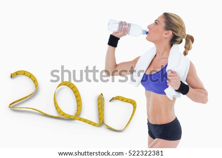 Strong blonde drinking from water bottle against white background with 3D new year