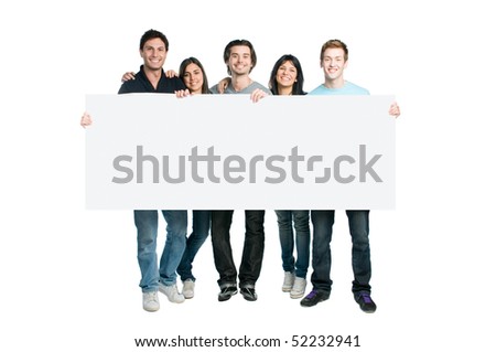 Happy young group of people standing together and holding a blank sign for your text, isolated on white background