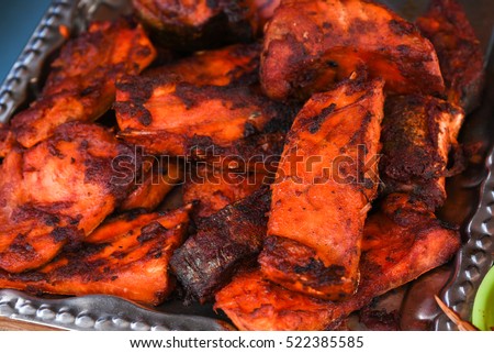 Fresh cooked/roasted/grilled/baked/deep fried hot and spicy King/barracuda/seerl fish fry/seafood in street food shop/stall in Velankanni/Chennai, Tamil Nadu, India. Marinated fish in Indian spices. 