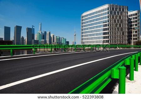 Empty road floor surface with modern city landmark buildings in Shanghai