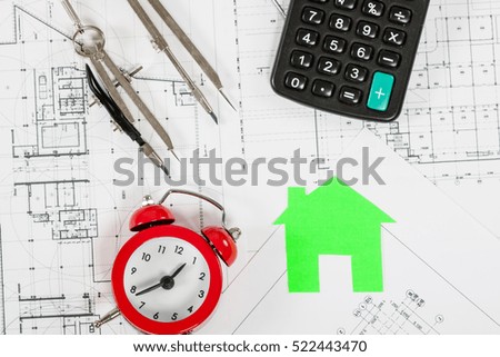 Architect workplace top view. Architectural project, blueprints, calculator, red alarm clock, keys, divider compass and pencil on desk table. Real Estate Concept.