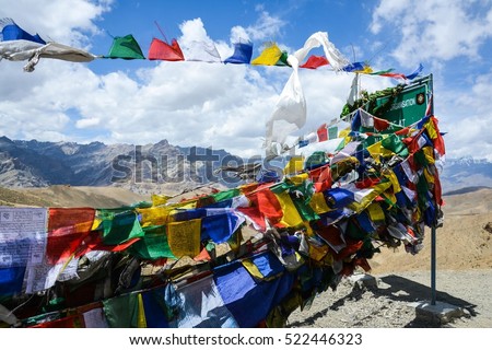 A lot of colorful Buddhist prayer flags with blue sky on mountain background on the road between Leh and Srinagar,India