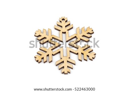 Winter, Christmas, New Year wooden decoration - snowflake, star. Isolated on white background. Top, side view. Closeup.
