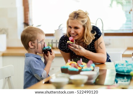 Child eating decorated beautiful muffins