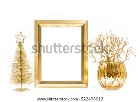 Golden picture frame and shiny christmas decoration