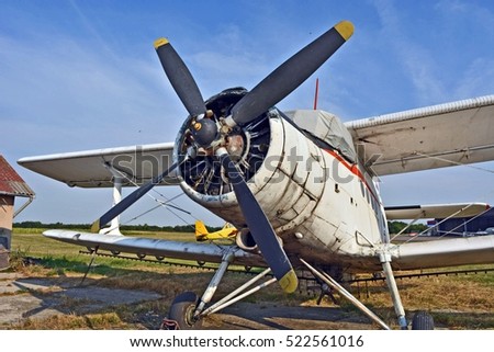Old propeller plane at the airport.