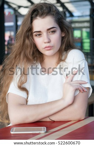 happy young woman sitting in cafe