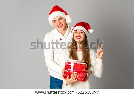 couple celebrate christmas with gifts