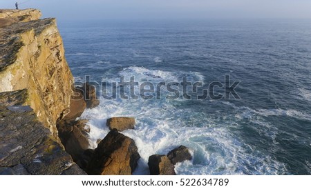 Waves crashing against rocks - Peniche cliffs in Portugal