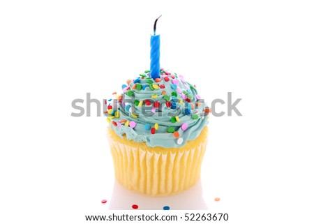 angelfood cupcake with blue frosting, sprinkles and a candle. isolated on white with room for your text or images