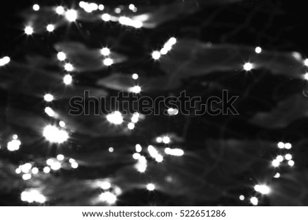 Swimming pool with sun reflections,Swimming pool background,Black and white