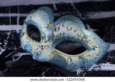 white blue mask diamond glitter on black and white grungy texture