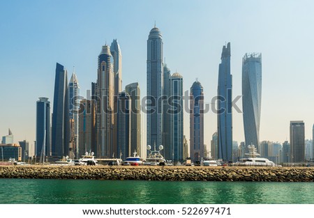 Luxury skyscrapers in center of Dubai, Unidet Arab Emirates. Dubai Marina in a summer day, United Arab Emirates. Royalty-Free Stock Photo #522697471