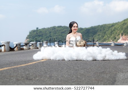 Beautiful bride outdoors on the road