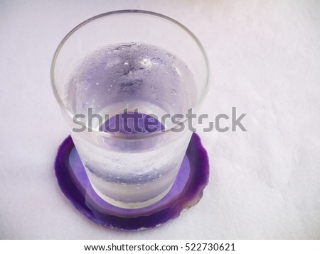 Glass of sparkling water with coaster