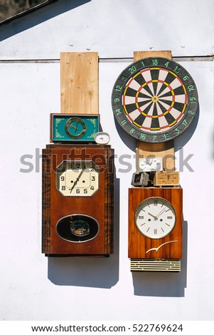 Swap meet. Wall clock, darts