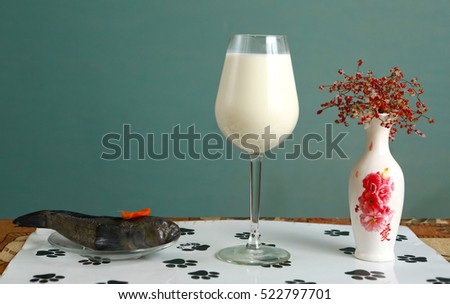 cats natural food still life - raw fish and milk as an illustration for healthy diet for pets