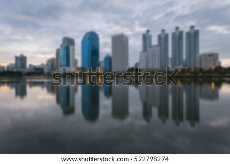 Blur City building with water reflection before sunset background