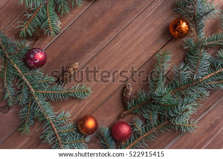 Spruce branch with Christmas balls for background. Winter wallpapers.Place for text