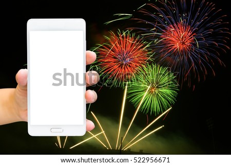Girl use smart phone , image of firework as a background.