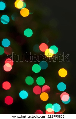 Multicolored defocused christmas bokeh blurry lights, festive background