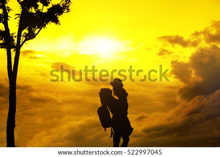 silhouette of a mother and son playing outdoors at sunset. Silhouette happy family
